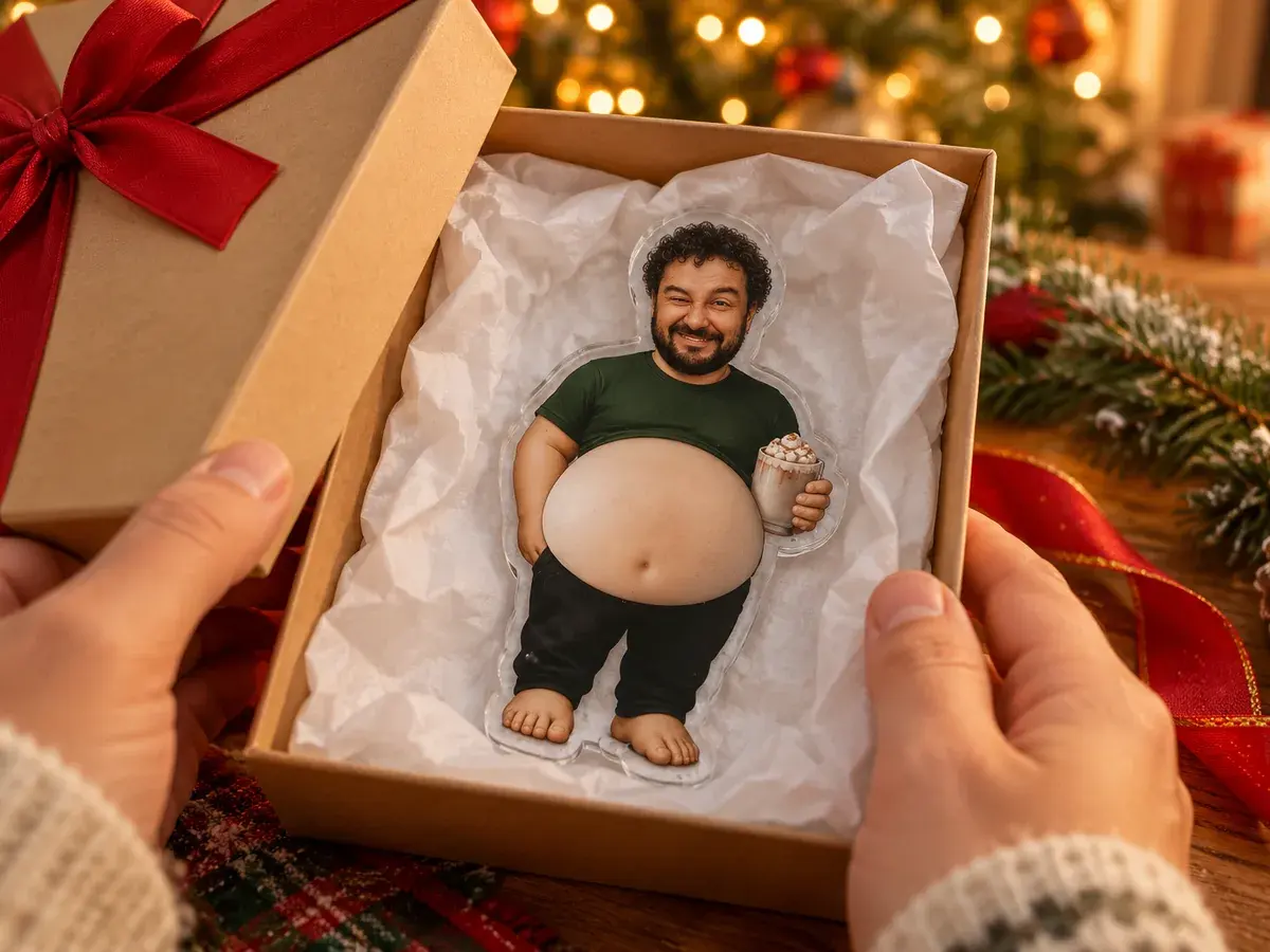 A magnet with a face from a photo in a gift box, Christmas tree lights behind it